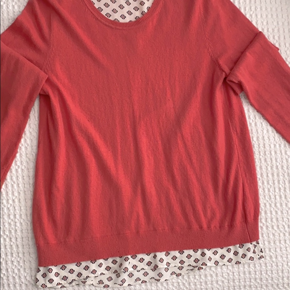 Pullover sweater with attached layer